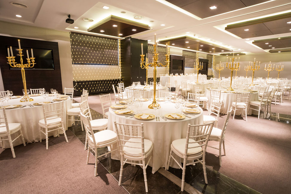 Styling featuring Cream Essential table linen, Gold Starburst charger plate paired with Cream Essential napkins, Gold Candelabras and Ivory Chiavari Chairs with Cream Essential seat pads